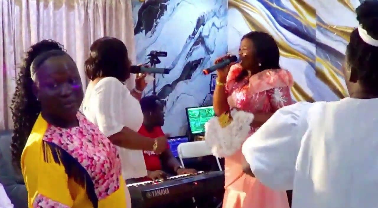 Singers and a keyboardist during a live worship session
